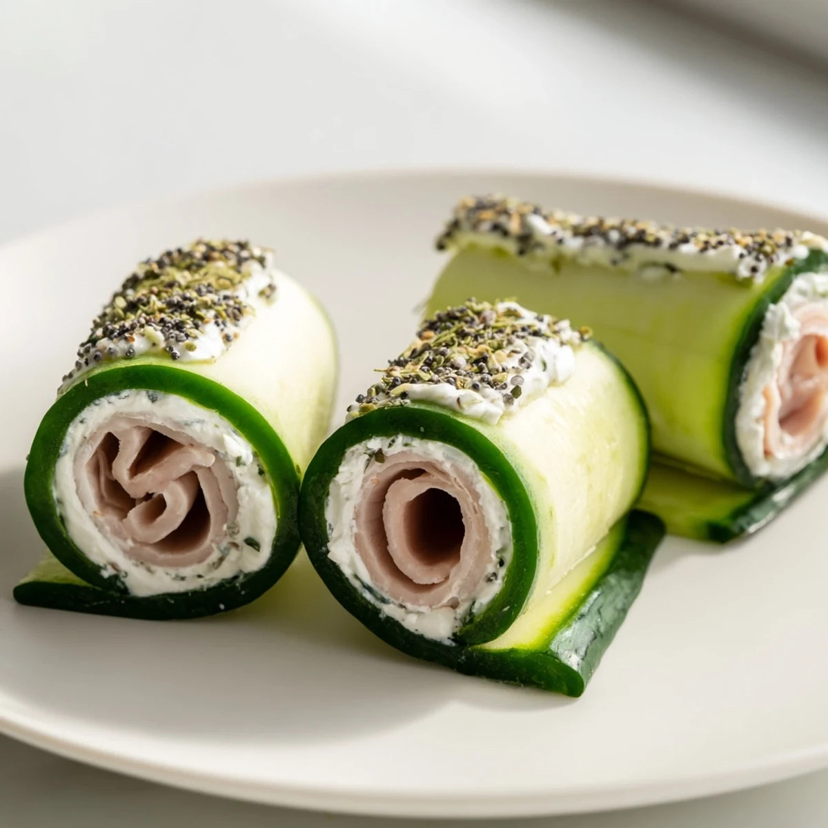 Cucumber roll-ups feature fresh cucumber spirals filled with creamy cheese and turkey.