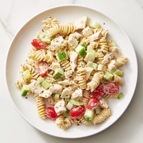 This Everything Bagel Chicken Pasta Salad features a refreshing mix of tomatoes, cucumbers, and perfectly seasoned chicken.